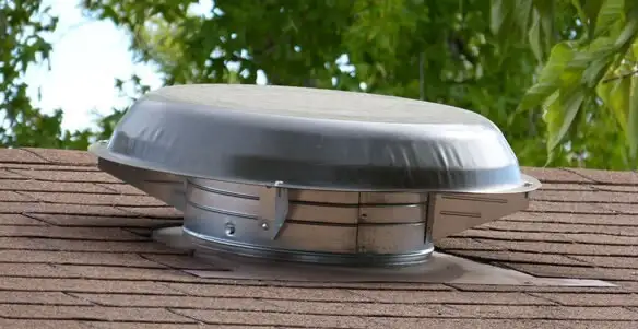 attic fan installation services with low-profile roof ventilation unit in Flagstaff, AZ