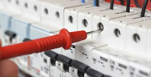 Electrical contractor testing circuit breakers during electrical repair in Clarkdale, AZ