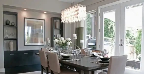Elegant dining room chandelier installation above table in Flagstaff, AZ