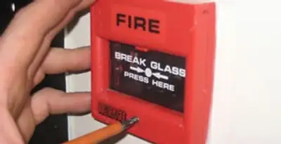 fire alarm installation service showing manual fire alarm pull station installed by licensed electricians in Flagstaff, AZ