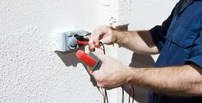 Electrician performing home electrical outlet and wiring inspection in Flagstaff, AZ