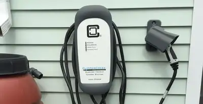 Outdoor electric vehicle charger installation on residential wall in Flagstaff, AZ