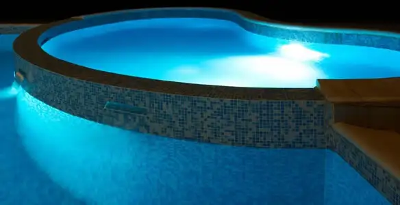 pool light installation and repair services highlighting illuminated pool interior lighting in Flagstaff, AZ