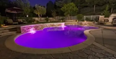 pool light installation and repair services illuminating a residential swimming pool in Flagstaff, AZ