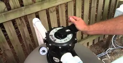 pool pumps service showing professional adjustment of pool pump control system in Flagstaff, AZ