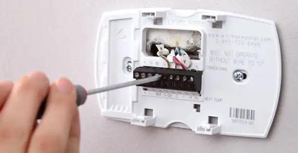 Thermostat installation service with proper wiring and secure wall mounting in Flagstaff, AZ