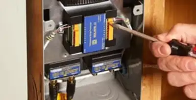 Whole home surge protection device being installed by a licensed electrician to protect electrical systems in Flagstaff, AZ